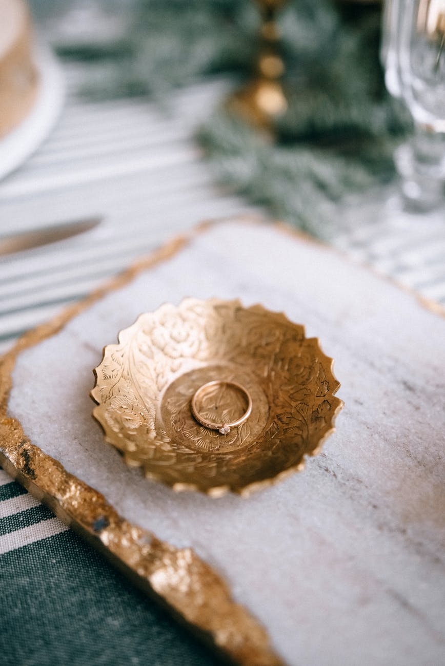 elegant engagement ring on plate on table