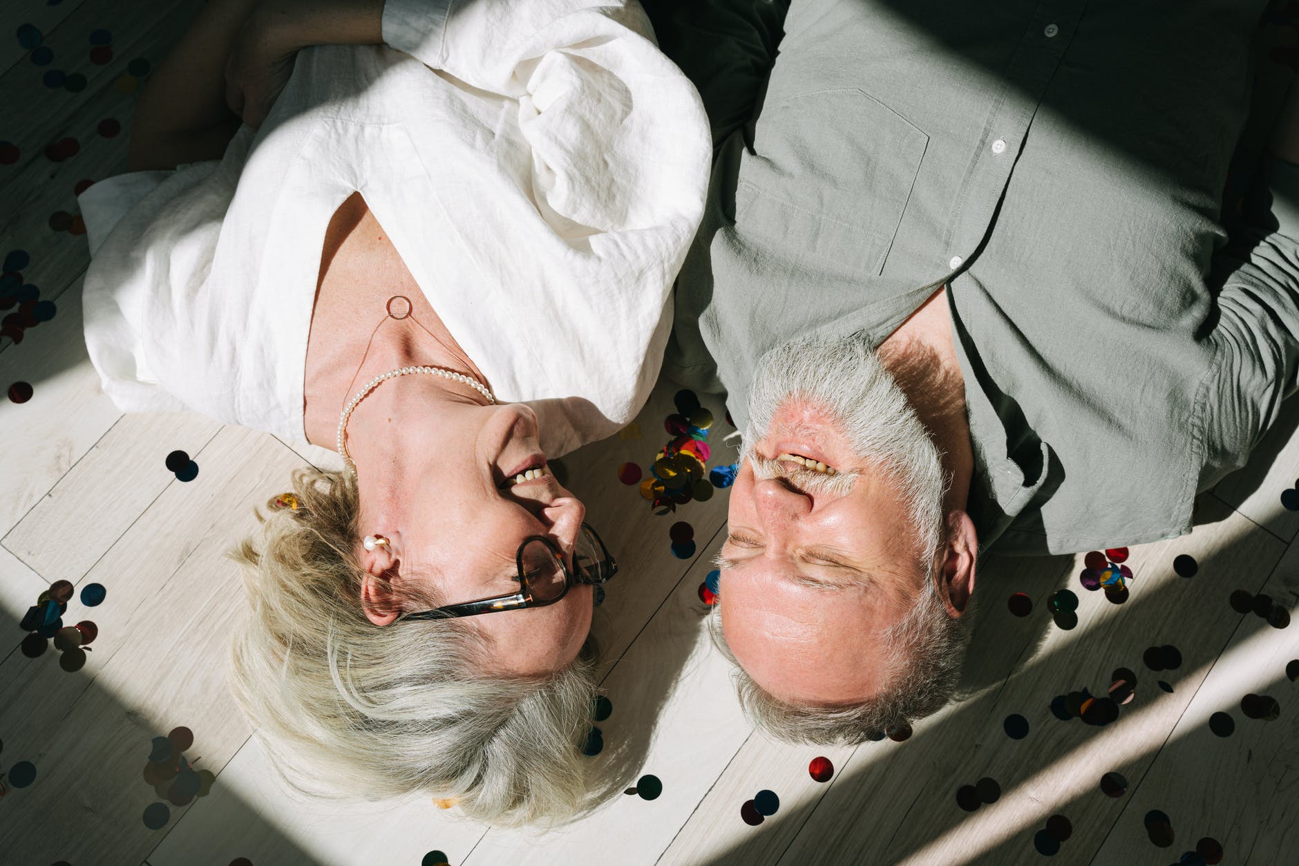 smiling couple lying on the floor