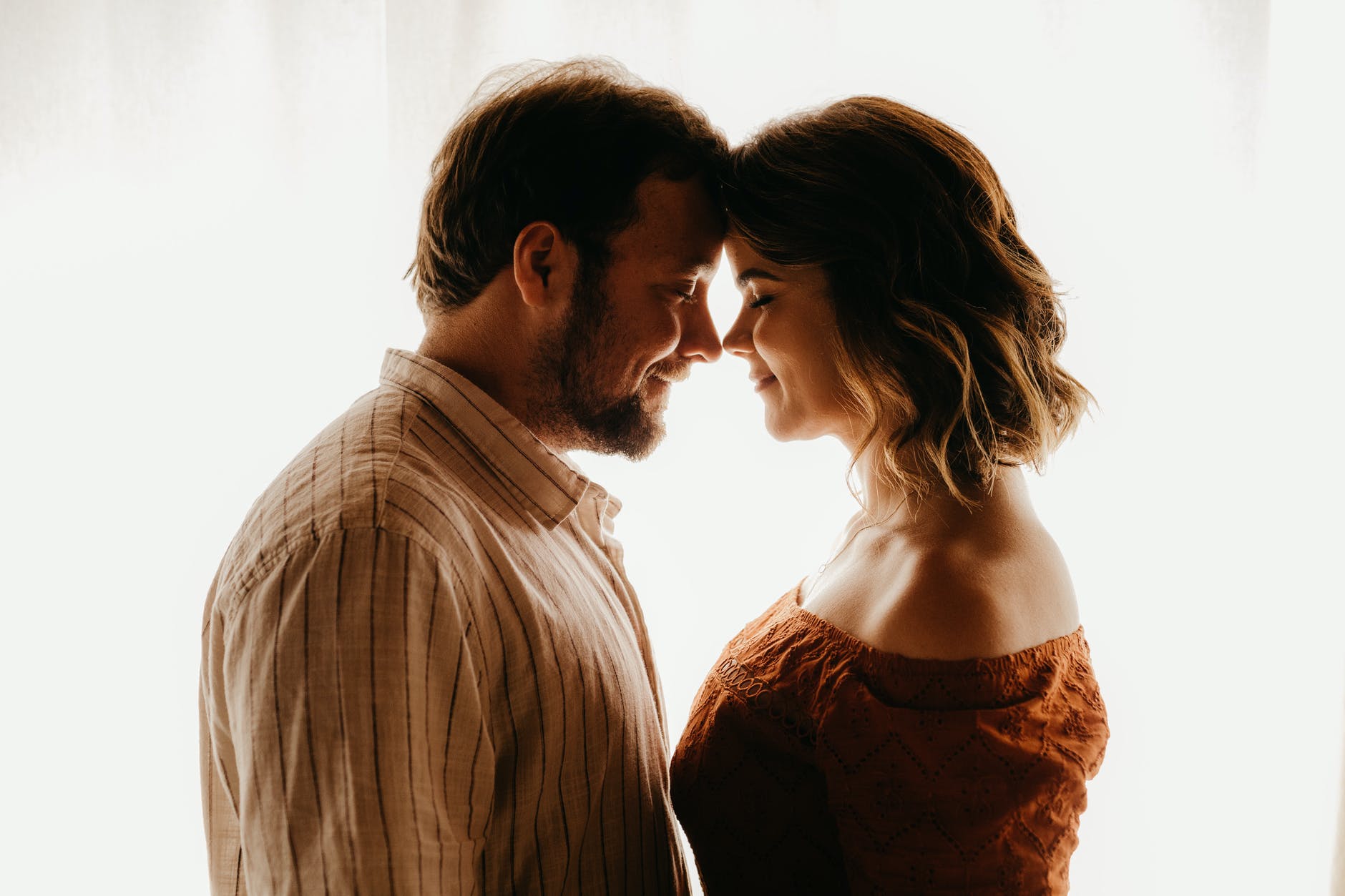 loving couple standing close in room